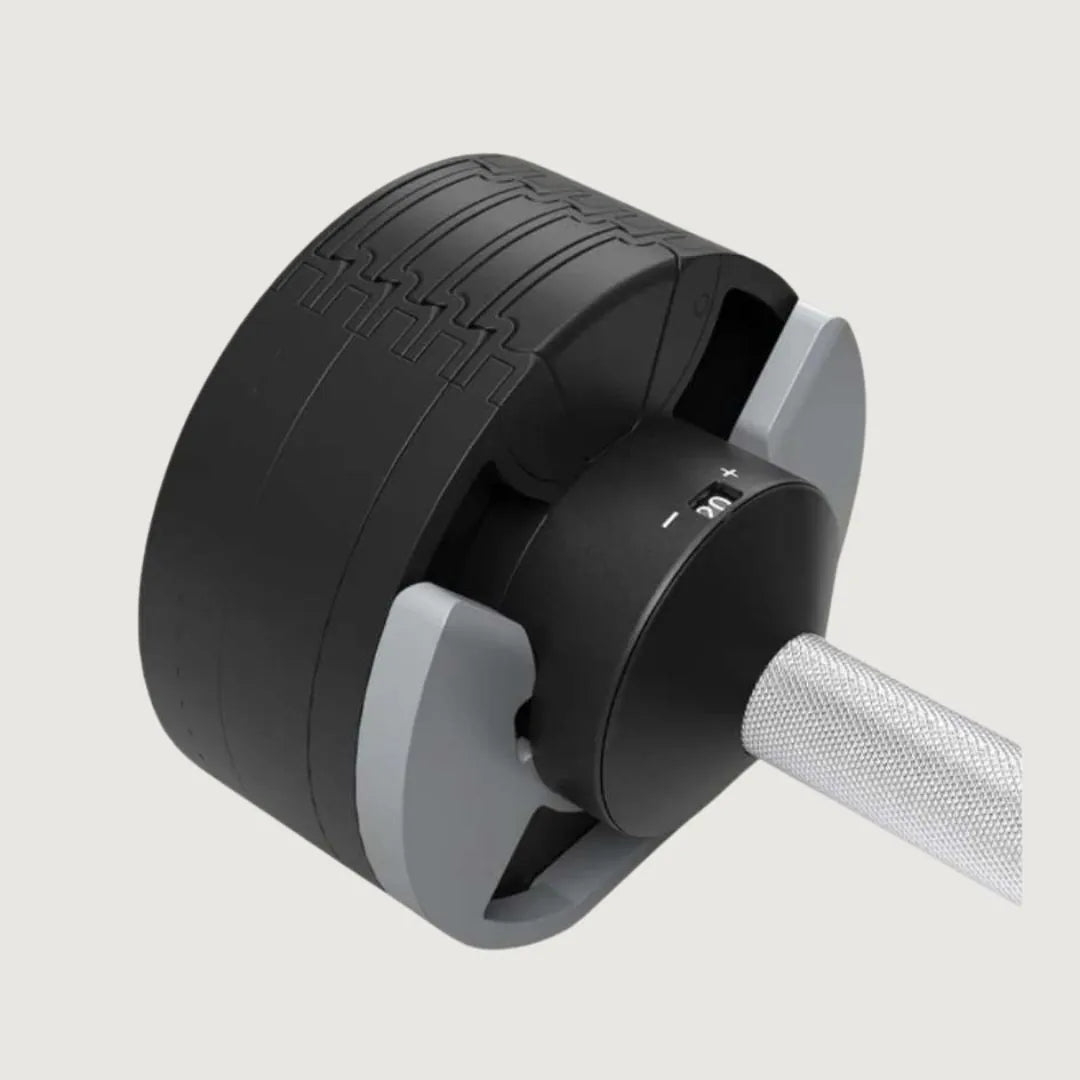 Close-up of the adjustment dial and knurled grip on a Horizon adjustable dumbbell.