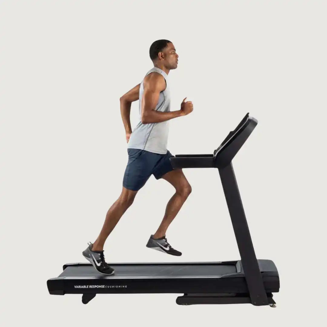 Man running on Horizon treadmill with Variable Response Cushioning