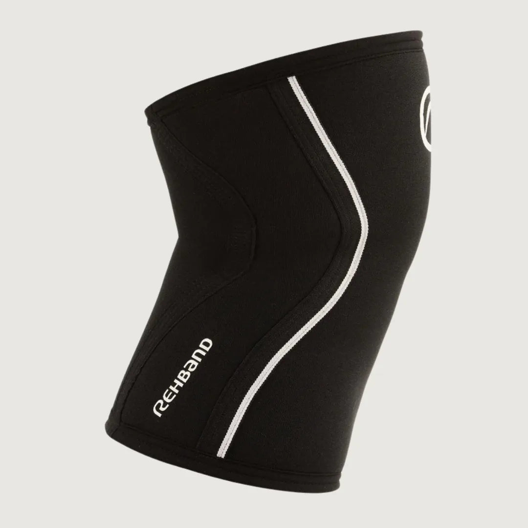Pair of black Rehband RX knee sleeves with white logo and curved support lines