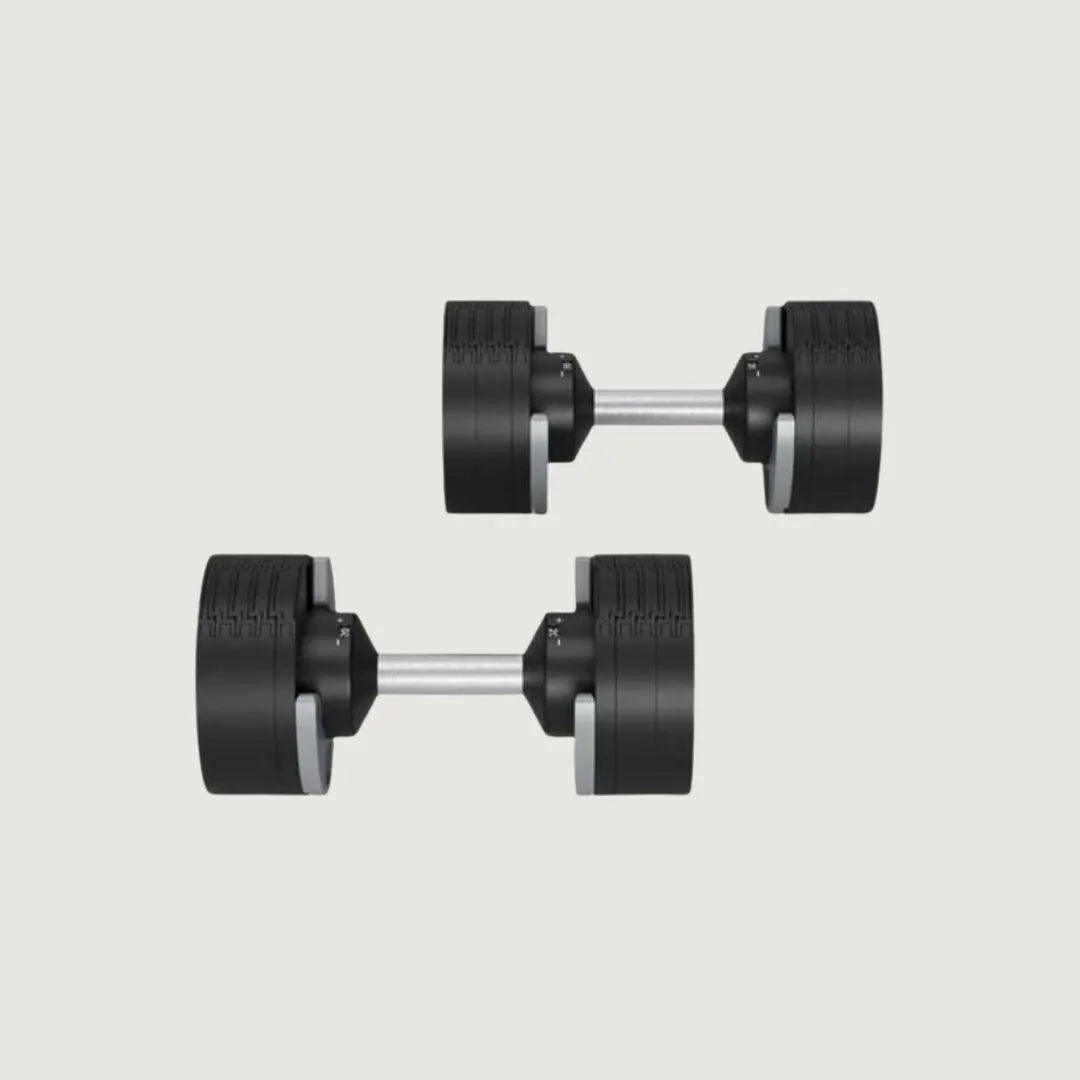 Top-down view of two adjustable dumbbells showing weight indicators and knurled handles.