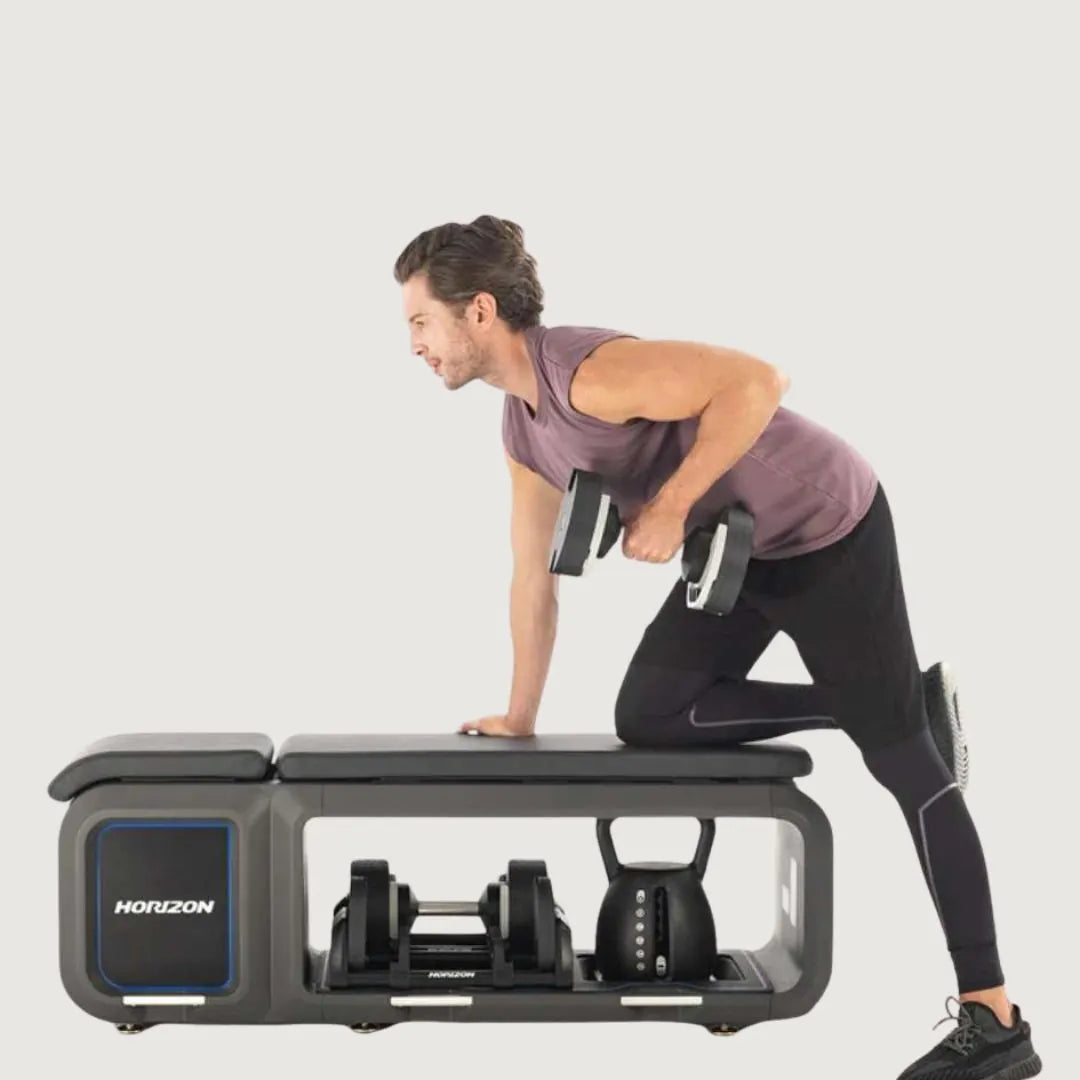 Man performing a single-arm dumbbell row on a Horizon fitness bench with storage compartments.