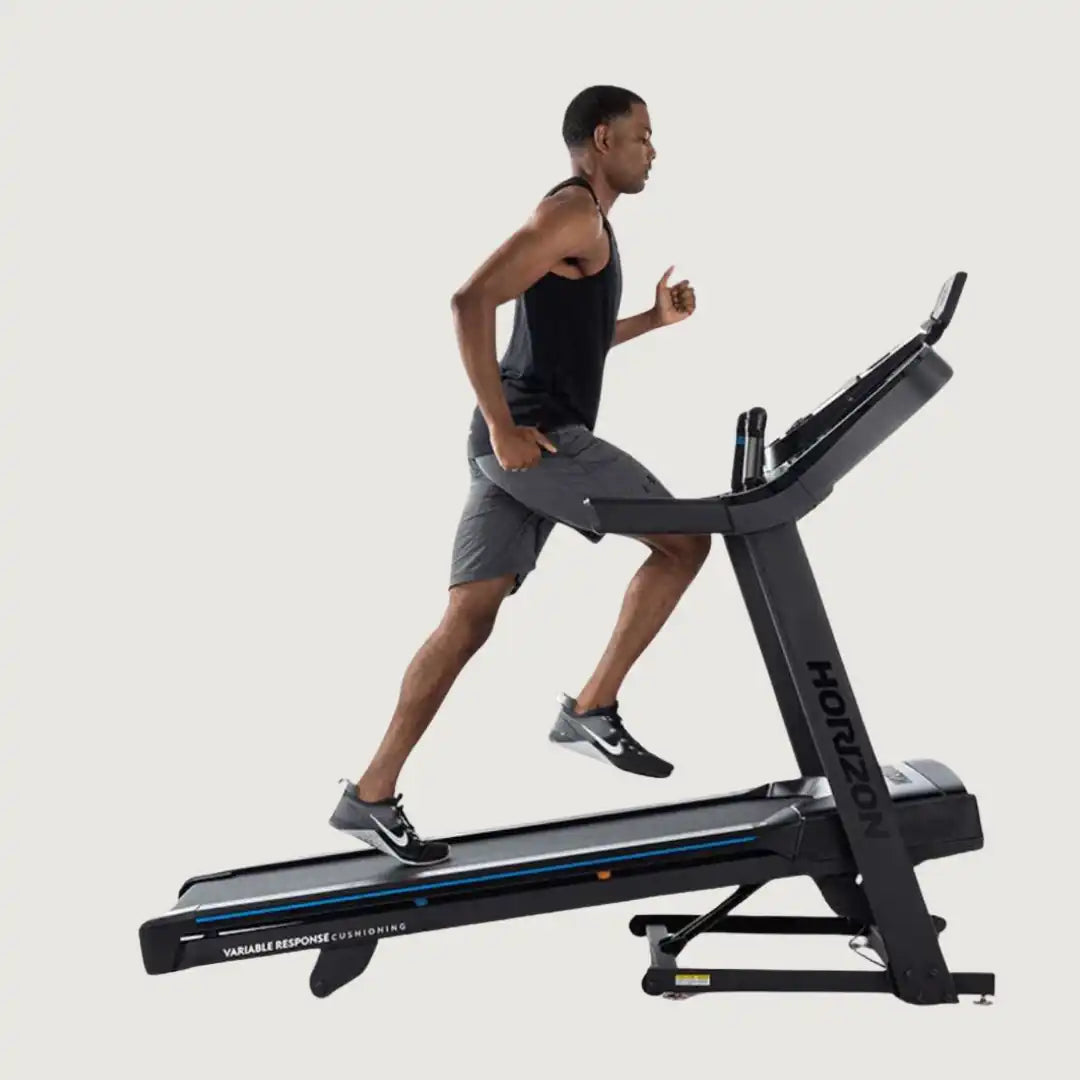 Man running on the Horizon treadmill with incline