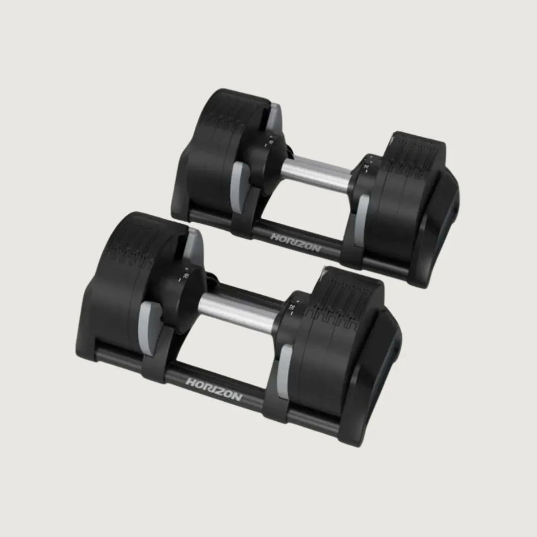 Pair of adjustable dumbbells with black weight plates and chrome handles on a light background.