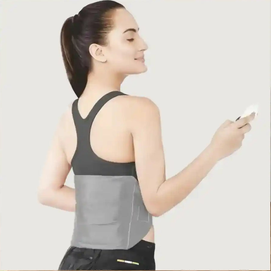 Woman wearing a gray athletic tank top with a white background