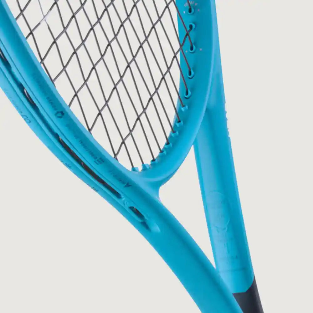 Close-up of a bright turquoise tennis racket showing the throat, strings, and part of the shaft against a light gray background.