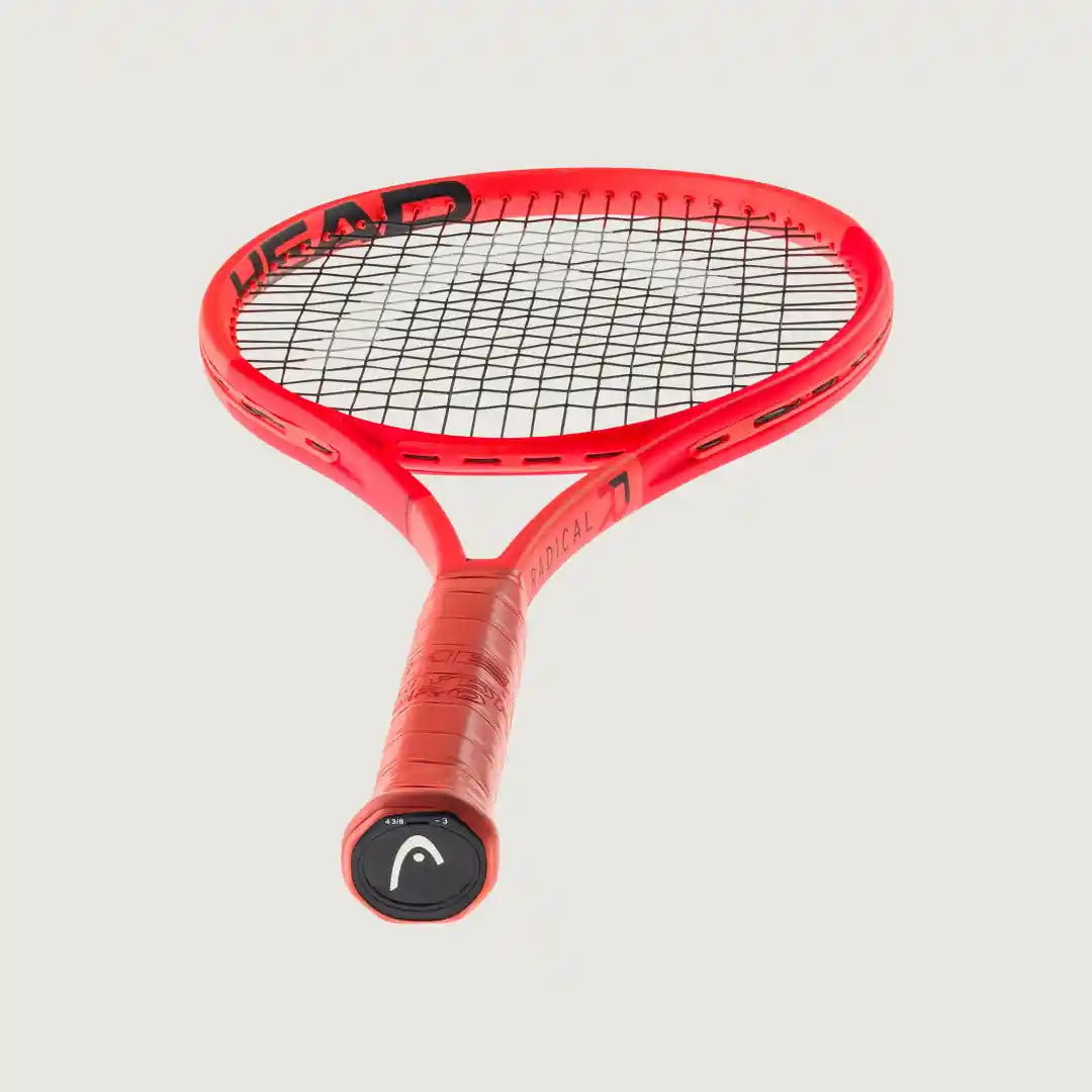 A red HEAD kids' tennis racket with black strings, shown from a top-down angle on a light gray background.