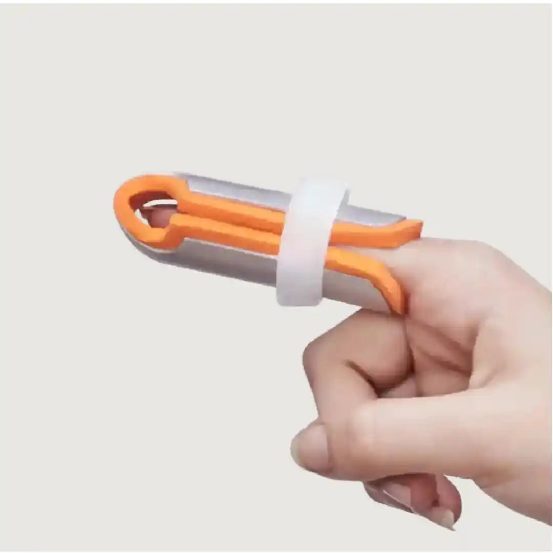 Hand holding a tool with orange and gray design on a light gray background