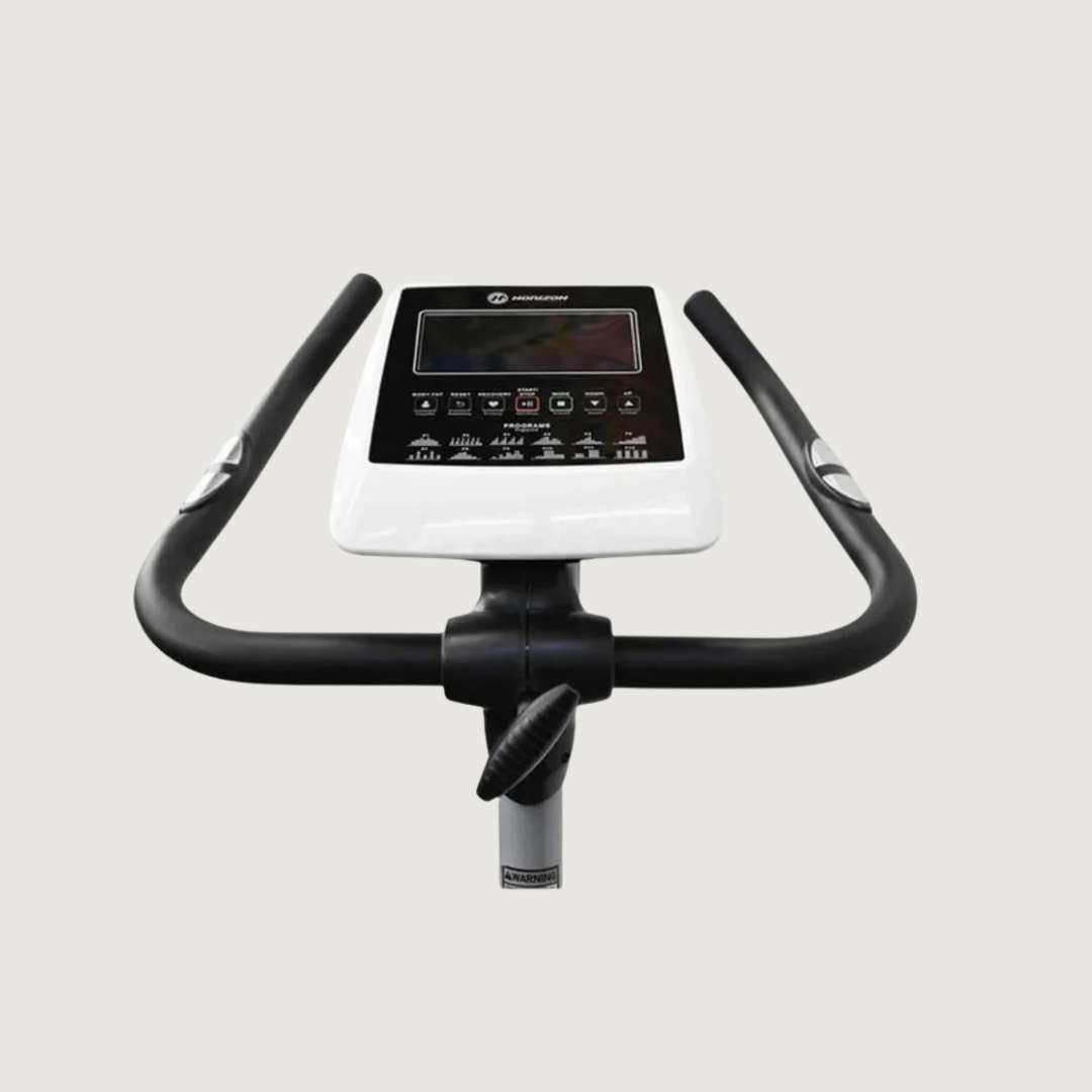 Exercise bike with digital display on a light gray background