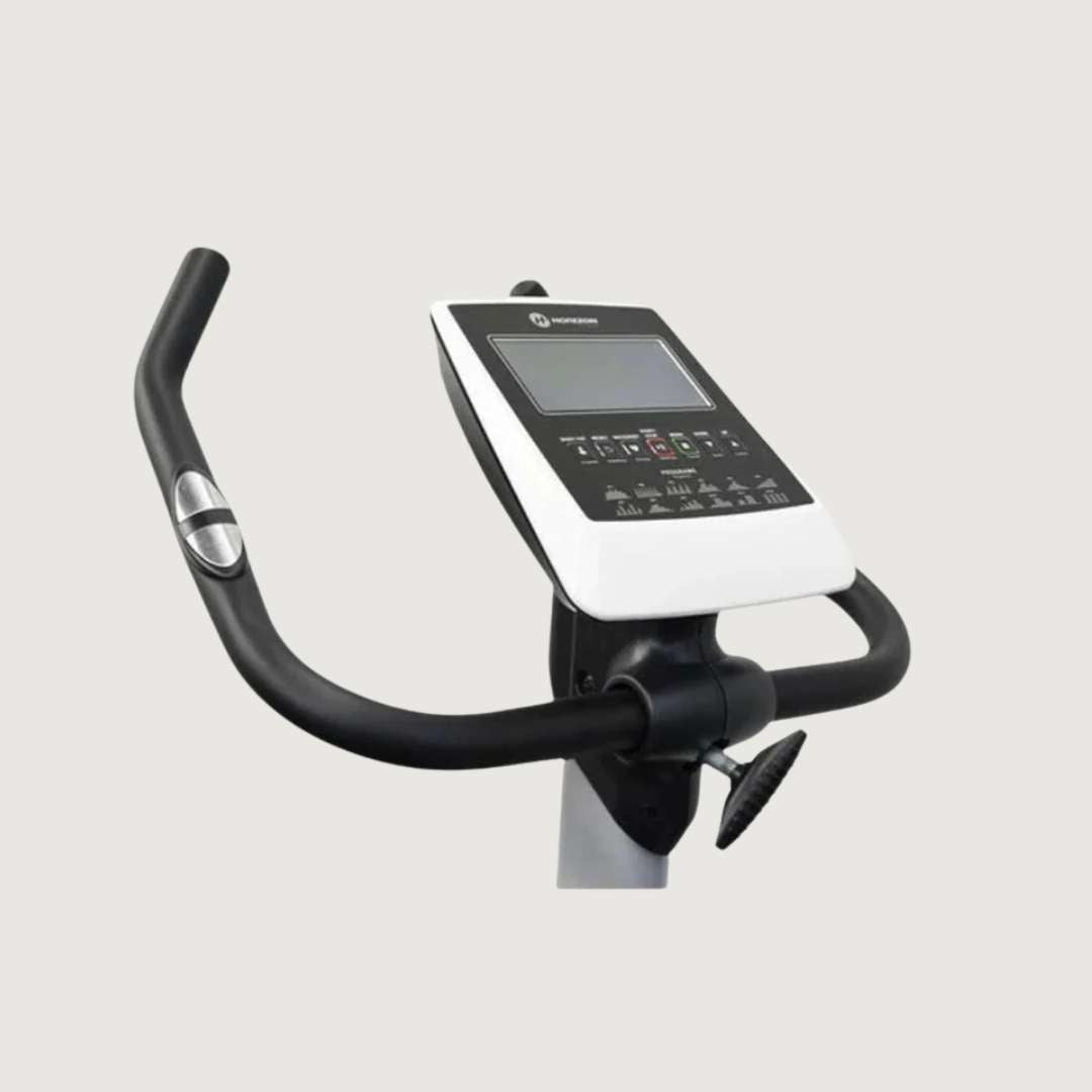Exercise bike with digital display on a light gray background