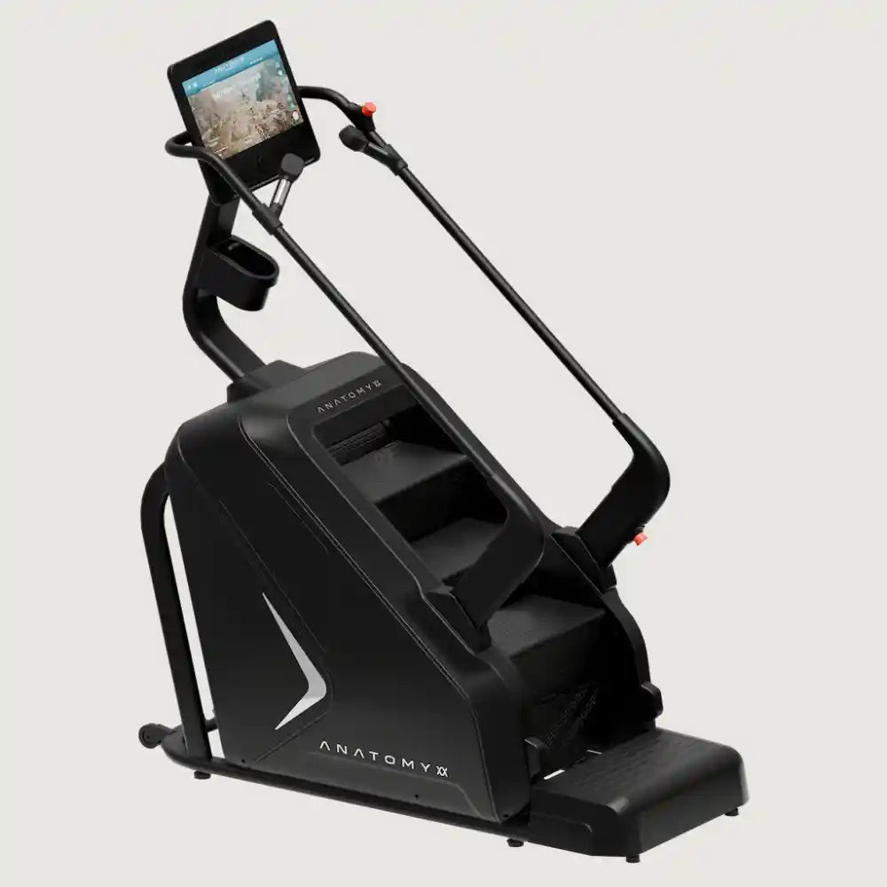 Black exercise machine with digital display on a light gray background