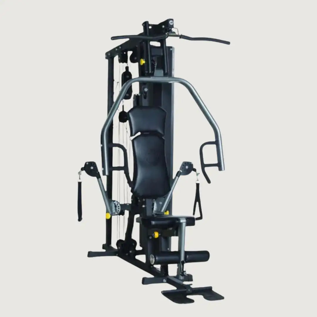 Full view of a multi-gym strength training machine with various attachments and padded seat.